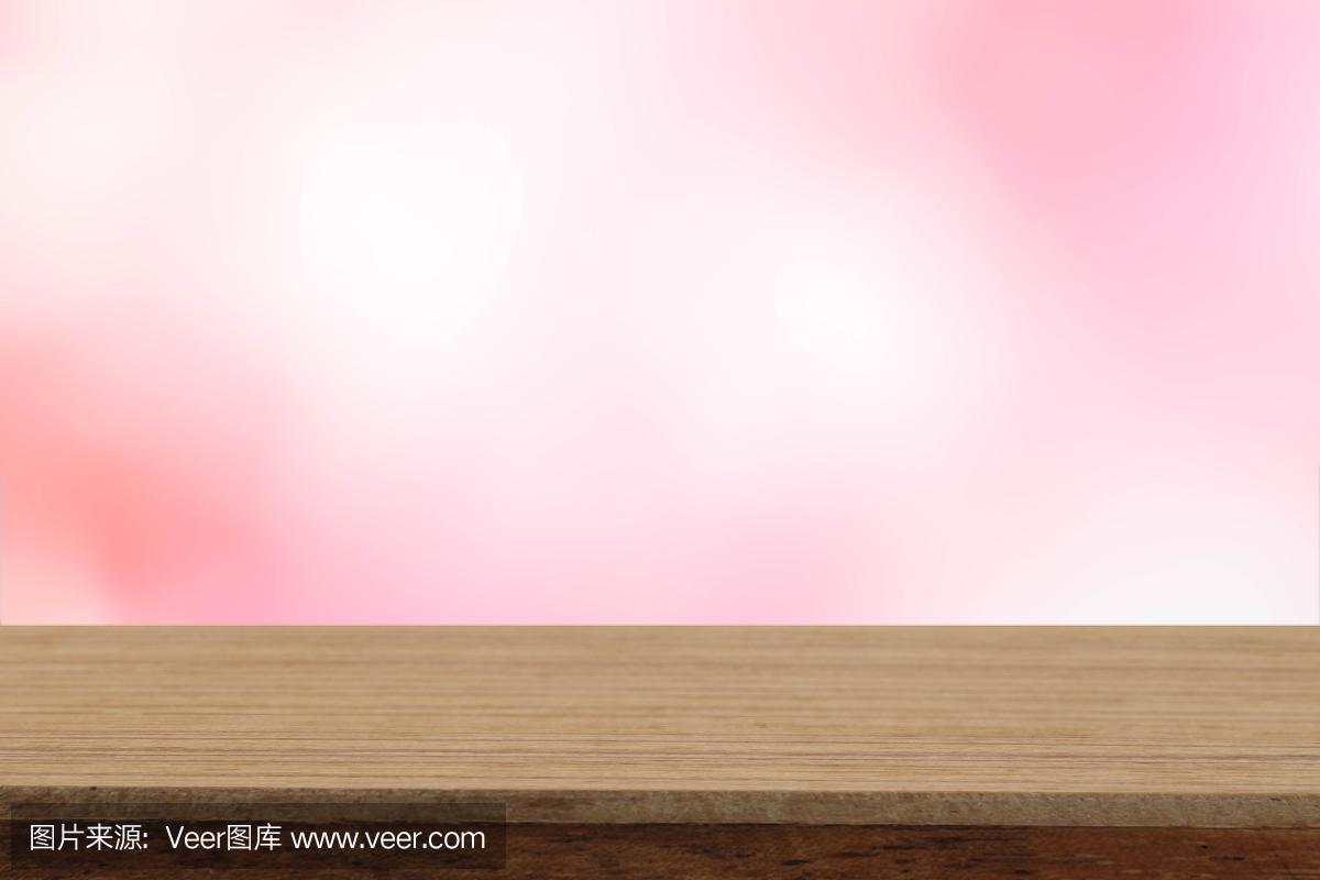 透视木桌子上的模糊玫瑰粉彩自然背景,可以用来模拟蒙太奇产品展示或设计布局。